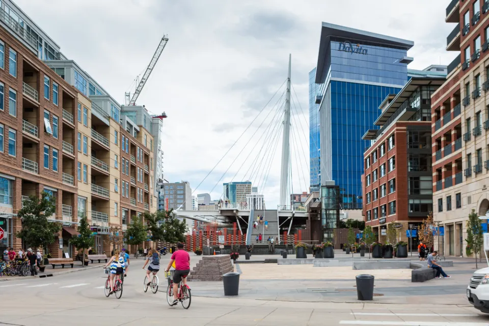 People on bikes in downtown Denver, Colorado